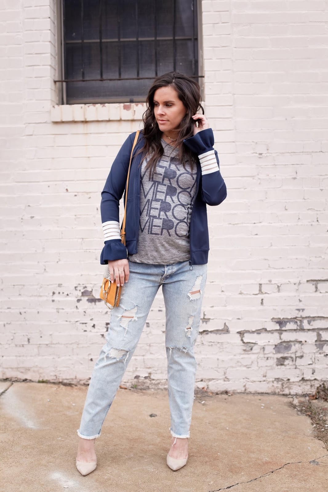 Distressed jeans and a track jacket