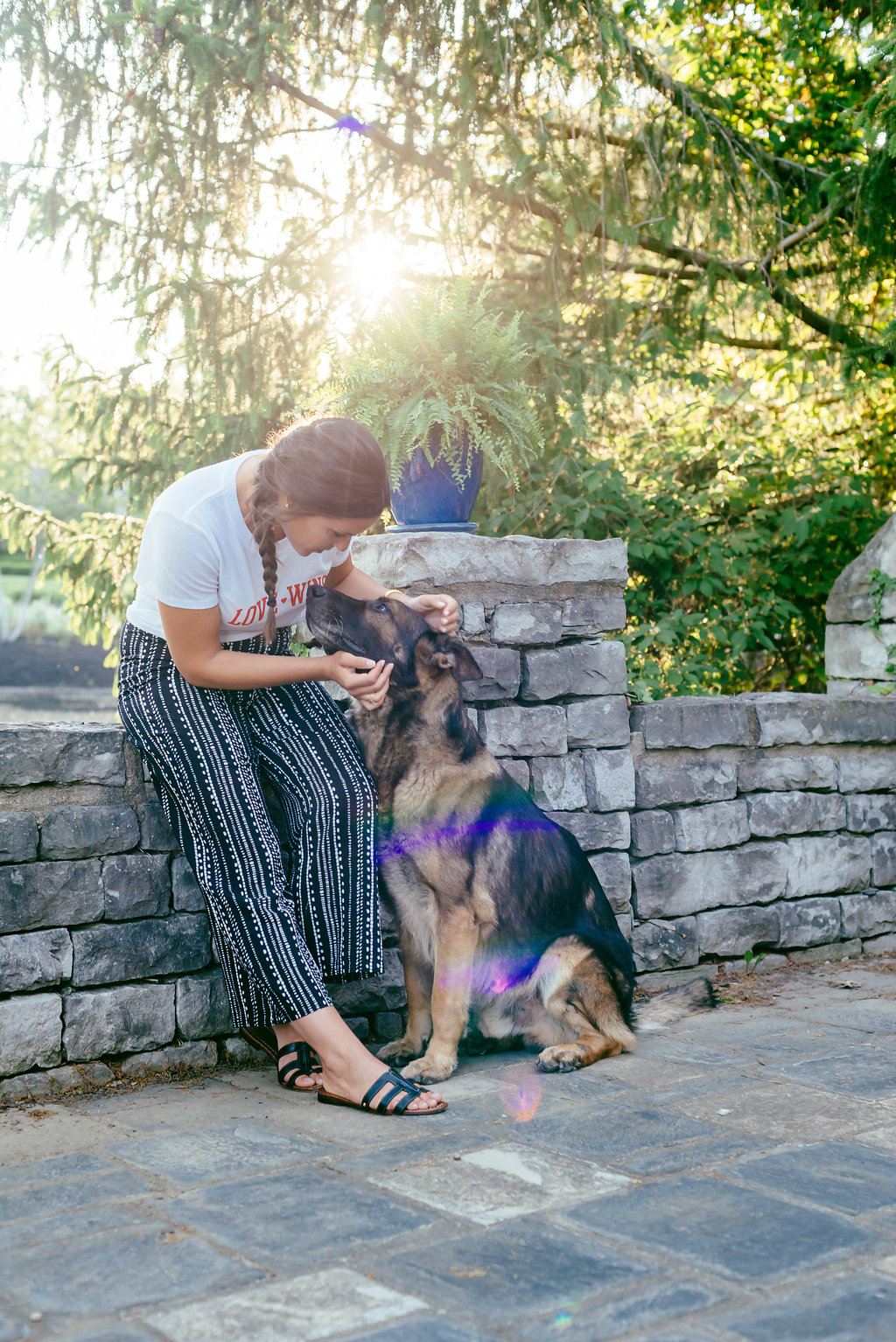 Love wins knotted tee and wide leg trousers and her german shepherd